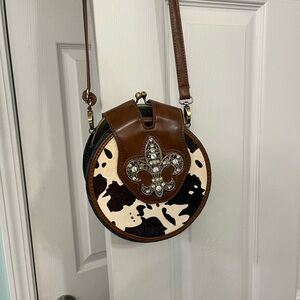 Elegant Brown and Black Crossbody Bag with Fleur-de-Lis